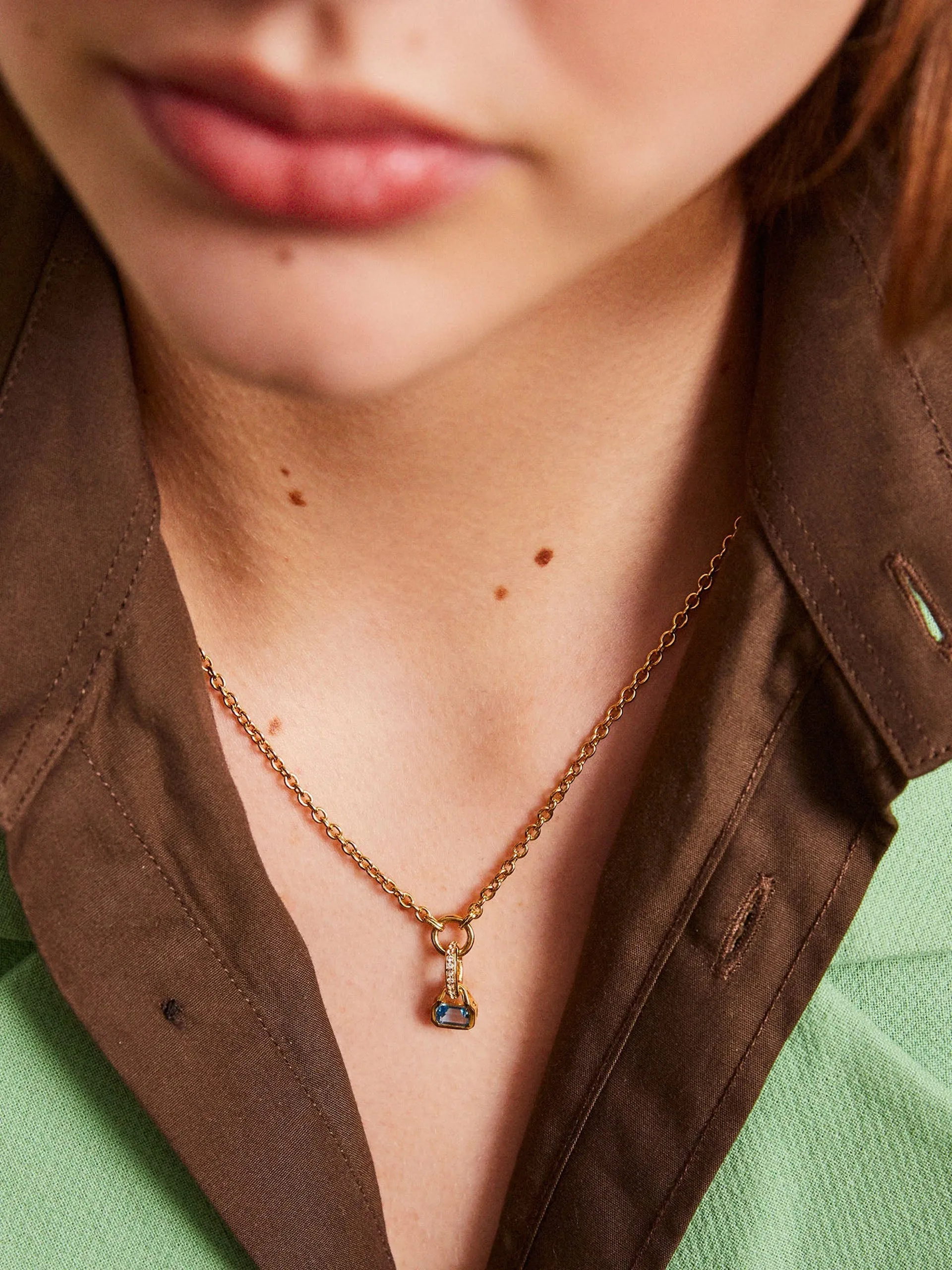 Blue Topaz charm on carrier chain